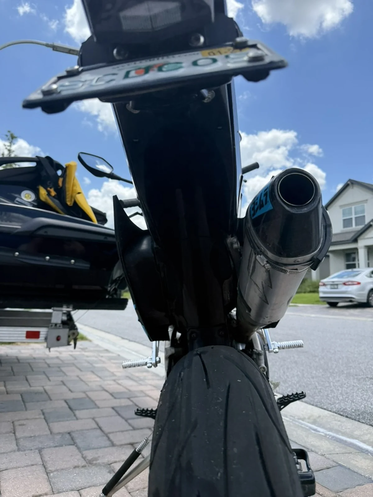 Blue motorcycle rear fender and rear wheel area after detailing, clean and restored