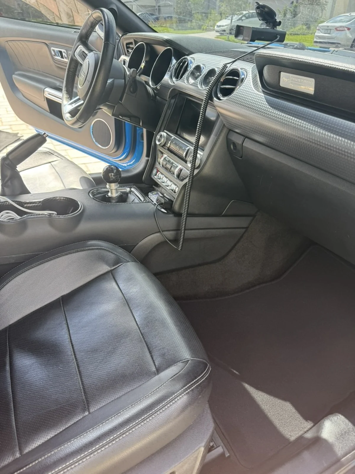 Blue Ford Mustang passenger floor and front cabin after detailing, clean and restored