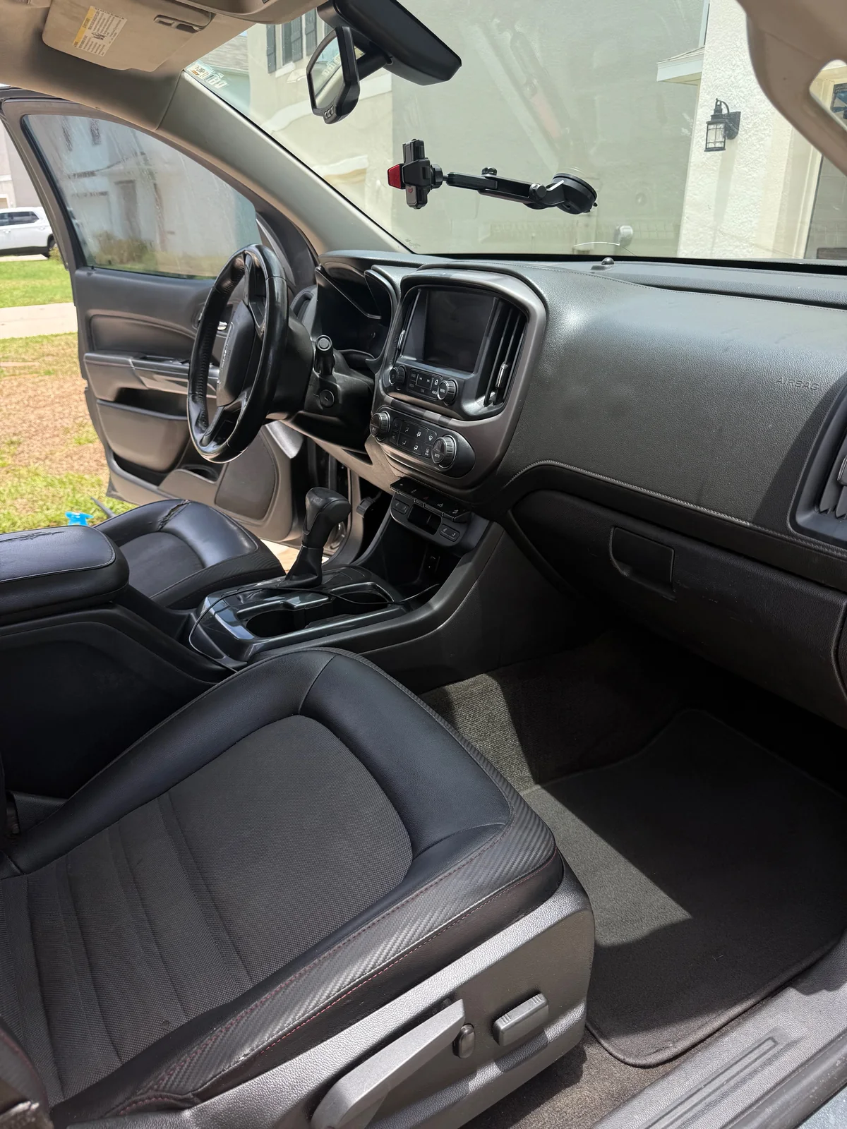 GMC pickup front passenger area after detailing, clean and uncluttered