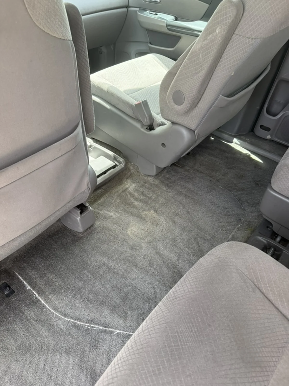 Honda Odyssey exposed second-row carpet after detailing, clean and vacuumed