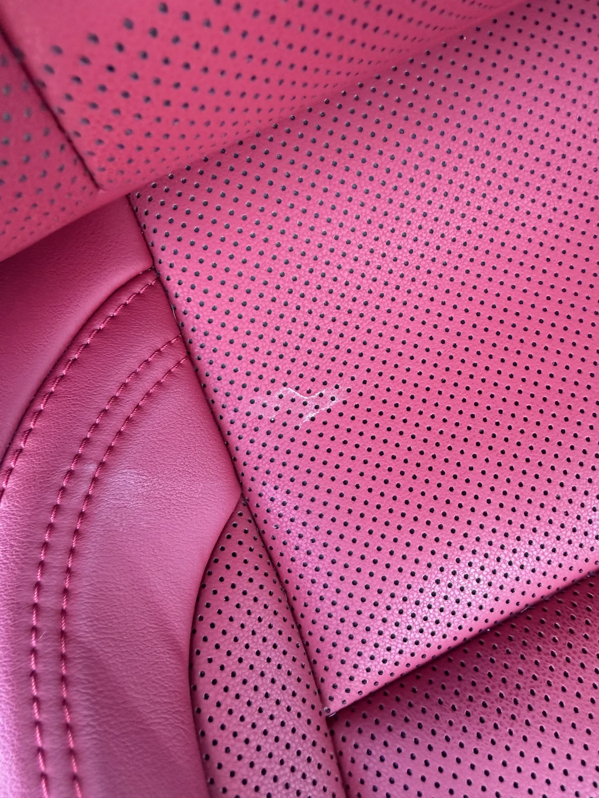 Lexus RC 350 red leather seat before detailing, with visible surface marks
