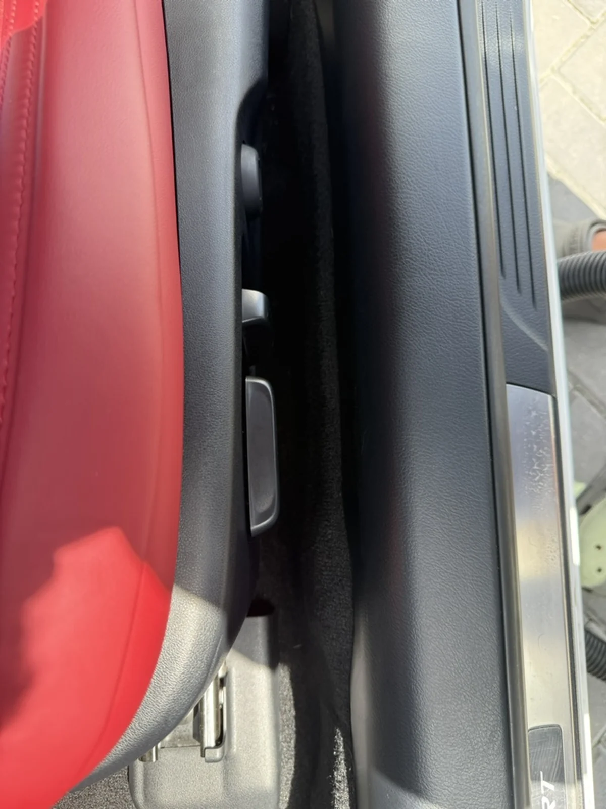 Lexus RC 350 carpeted gap beside the seat controls after detailing, clean and vacuumed