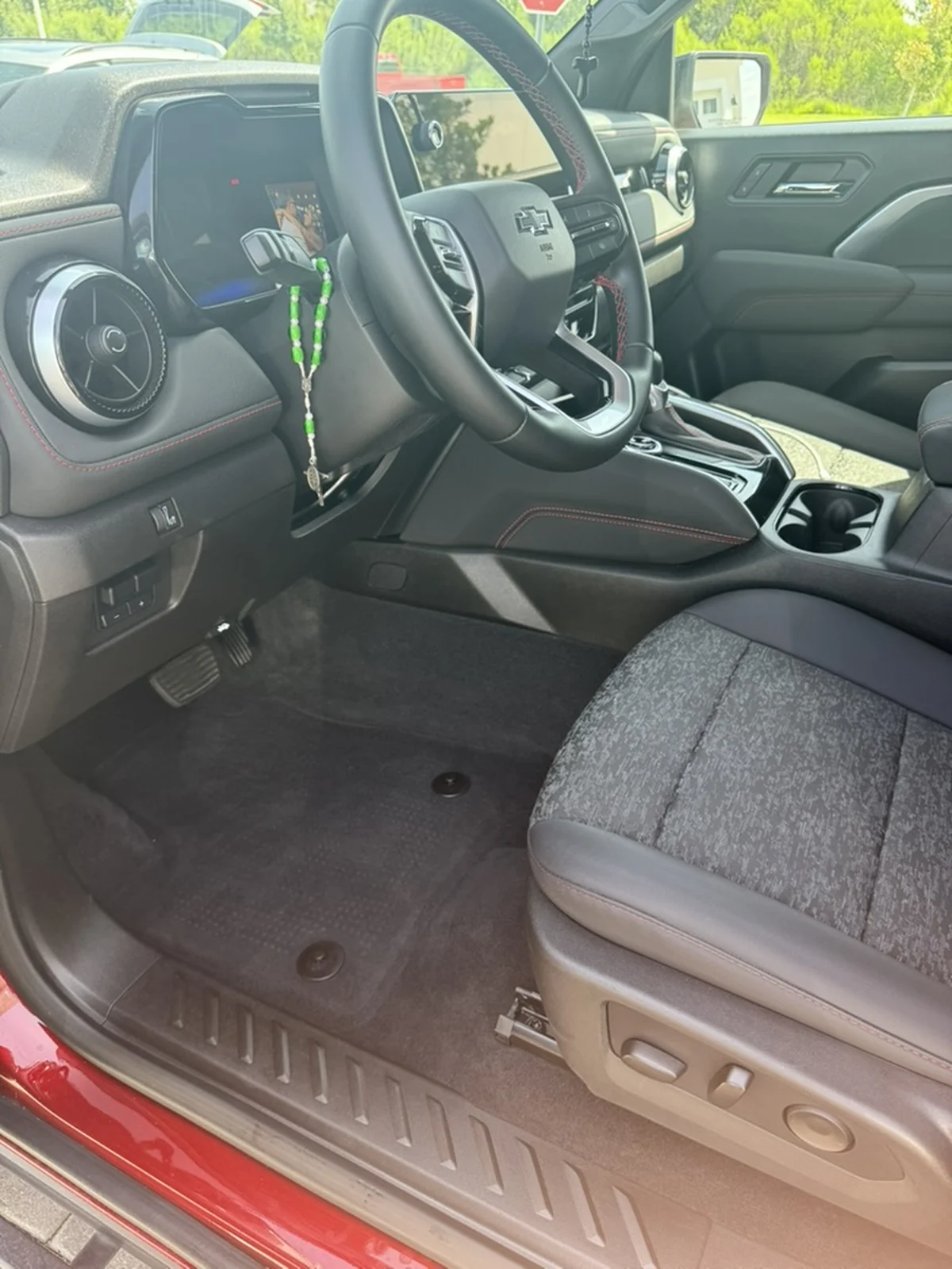 Red Chevrolet pickup driver entry and front cabin after detailing, clean and restored